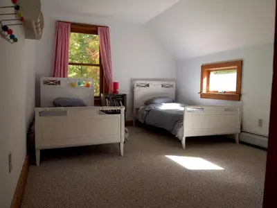 a bedroom with two beds and a window at Modern and Family-Friendly Vacation Rental in the Berkshires near Great Barrington in Monterey