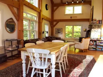 a living room with a wooden table and chairs at Modern and Family-Friendly Vacation Rental in the Berkshires near Great Barrington in Monterey
