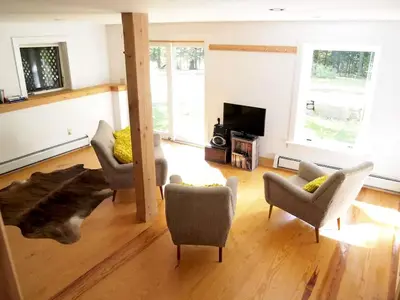 a living room with two chairs and a couch at Modern and Family-Friendly Vacation Rental in the Berkshires near Great Barrington in Monterey