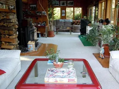 a living room with a table in the middle of it at Family-Friendly Cabin in the Deerfield Valley of Mount Snow, West Dover Vermont in West Dover