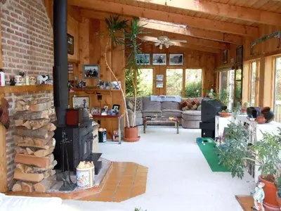 a living room with a fireplace in a house at Family-Friendly Cabin in the Deerfield Valley of Mount Snow, West Dover Vermont in West Dover