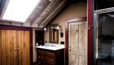 a bathroom with a sink and a mirror at Gorgeous Green Mountains Vacation Rental with a Pool in Manchester, Vermont in Manchester Center