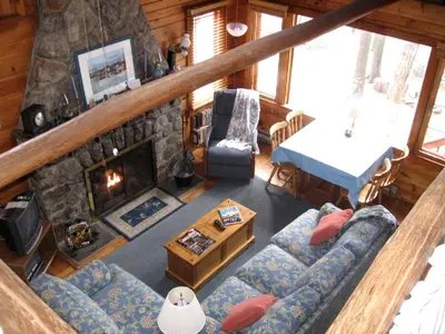 an overhead view of a living room with a fireplace at Idyllic Waterfront Log Cabin in Wayne County Overlooking Lake Wallenpaupack, Pennsylvania in Lakeville