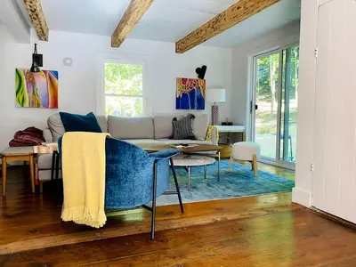 a living room with a couch and a table at Modern Cottage Perfect for Glamping in New York State in Accord