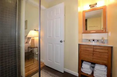 a bathroom with a sink and a mirror at Fabulous New York Cottage Rental near Ashokan Reservoir in Glenford