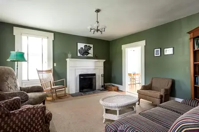 a living room with green walls and a fireplace at Secluded Cottage Rental with a Fireplace in Greenville, New York in Greenville