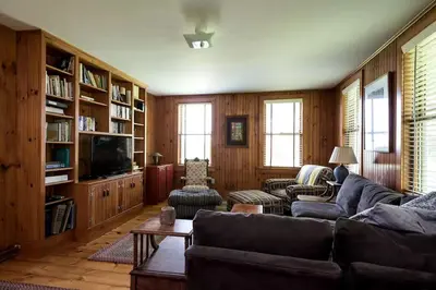 a living room with a couch and a tv at Secluded Cottage Rental with a Fireplace in Greenville, New York in Greenville