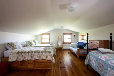 a bedroom with two beds and a couch at Secluded Cottage Rental with a Fireplace in Greenville, New York in Greenville