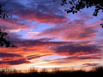 a sunset with colorful clouds in the sky at Gorgeous Getaway Suite in a Converted Barn near Hudson, New York in Hudson