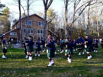 a group of men in tartan kilts playing music at Enormous Family-Friendly Cabin Rental in Shawangunk Mountains, New York in Pine Bush