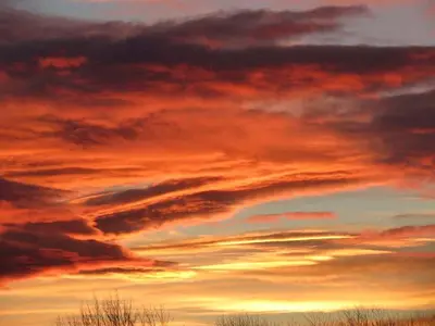 a sunset in the sky with clouds at Pet-Friendly Vacation Rental on a Working Farm near Hudson, New York in Hudson