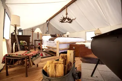 a bedroom with a bed in a tent at Stylish Camping Tents Set on an Organic Farm in Hudson Valley, New York State in Ghent