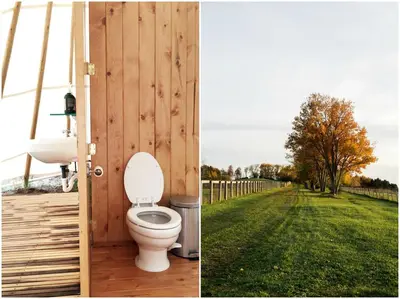 a bathroom with a toilet and a field of grass at Stylish Camping Tents Set on an Organic Farm in Hudson Valley, New York State in Ghent