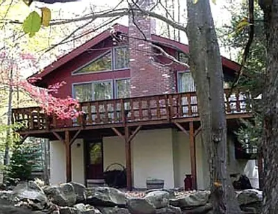 a red and white house with a balcony on it at Secluded Family Mountain Rental with Fireplace in Windham, New York in Windham