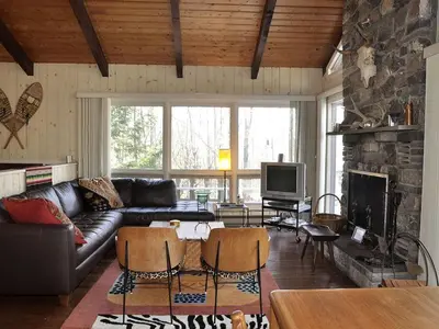 a living room with a couch and a fireplace at Secluded Family Mountain Rental with Fireplace in Windham, New York in Windham
