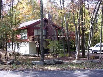 a red house with a car parked in front of it at Secluded Family Mountain Rental with Fireplace in Windham, New York in Windham