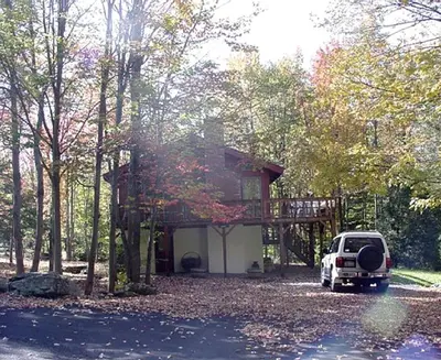a white suv parked in front of a house at Secluded Family Mountain Rental with Fireplace in Windham, New York in Windham