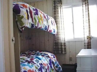 a bedroom with a bed and two pillows on it at Secluded Family Mountain Rental with Fireplace in Windham, New York in Windham