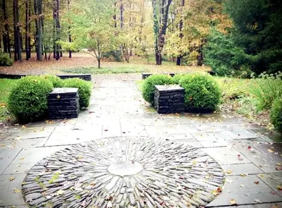a garden with two benches on a stone path at Romantic Year-Round Cabin Getaway with Free Wi-Fi in Saugerties, New York in Saugerties