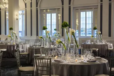 a room full of tables and chairs with flowers at Renaissance Albany Hotel in Albany