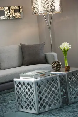 a living room with a couch and a coffee table at Renaissance Albany Hotel in Albany