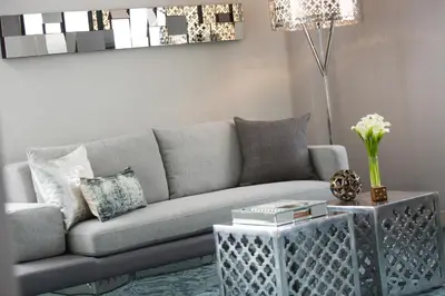 a living room with a couch and a table at Renaissance Albany Hotel in Albany