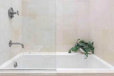 a bath tub with a plant sitting on top of it at Epic architectural masterpiece views & hot tub in Accord