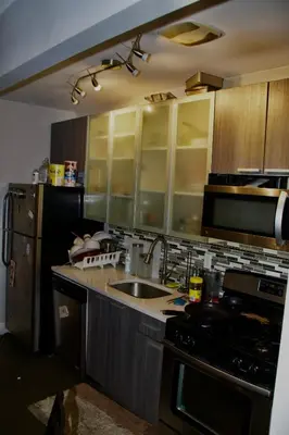 a kitchen with a sink and a stove at Guest First b4 Anything in Fresh Pond