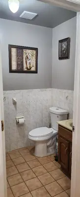 a bathroom with a toilet and a sink at Joy queen room 6A in Newark