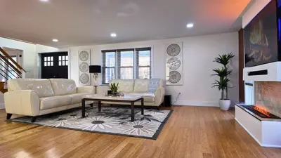 a living room with a couch and a table at Catskills Escape Hot Tub Massage Chairs & Games in Round Top