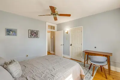 a bedroom with a bed and a ceiling fan at 1 Mi to Dtwn Schenectady Apt in Stockade District in Schenectady