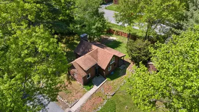 an overhead view of a house in the trees at The Bears Nest in Boiceville