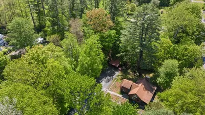 an overhead view of a house in the forest at The Bears Nest in Boiceville