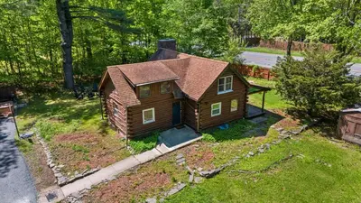 an aerial view of a small house in the grass at The Bears Nest in Boiceville