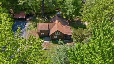 an aerial view of a house in the woods at The Bears Nest in Boiceville