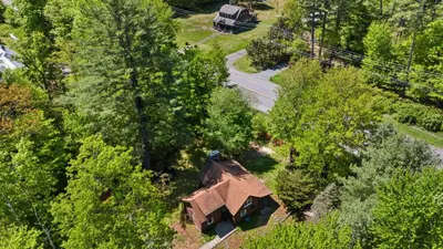 an overhead view of a house in the trees at The Bears Nest in Boiceville