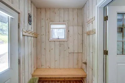 a tiny house with a bench in the corner at Ski, Hike and More Year-Round Gem in Windham in Windham