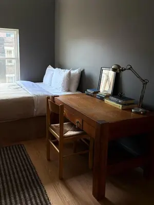 a bedroom with a desk with a bed and a desk sidx sidx sidx at 3.8 Million Dollar Brownstone Newly Renovated in New York
