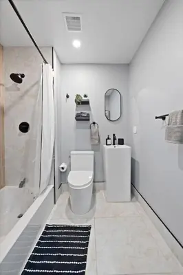 a bathroom with a toilet and a shower and a sink at Luxury and Chic 2BR 2BA Apt Mins to NYC and Hoboken in Jersey City
