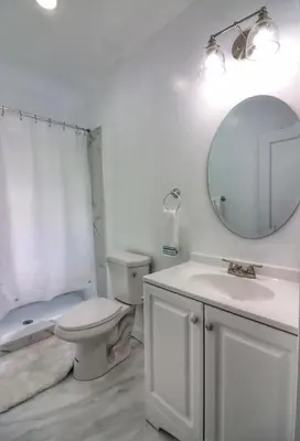 a bathroom with a toilet and a sink and a mirror at Cozy two bedroom home close to everything in Amsterdam