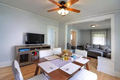 a living room with a dining table and a tv at Cozy two bedroom home close to everything in Amsterdam