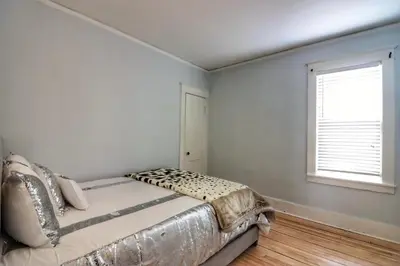 a bedroom with a bed and a window at Cozy two bedroom home close to everything in Amsterdam