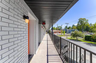a hallway of a building with a black roof at Ambler Hotel in Saratoga Springs