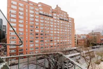 a large red brick building in a city at Blueground Manhattan wd AC nr park NYC-1829 in New York