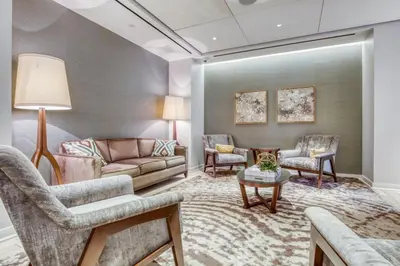 a living room with a couch and chairs at Blueground LIC pool wd nr Gantry Park NYC-1845 in New York