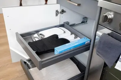 a drawer in a cabinet with a box in it at Chic Studio Close to Harbor Point in Stamford