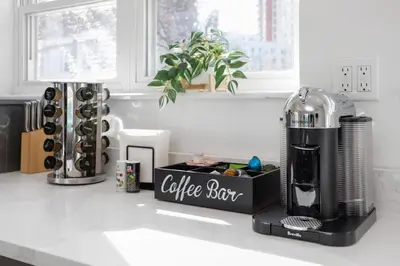 a coffee set sitting on top of a kitchen counter at Chic Studio Close to Harbor Point in Stamford