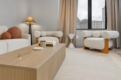 a living room with a couch and two chairs at Modern and Harford Center 1-BR Near XLCenter and ConventionCenter in Hartford