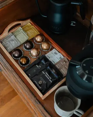 a tray of chocolate muffins on a table at Book Village Inn - Twain Room Queen Bed in Hobart