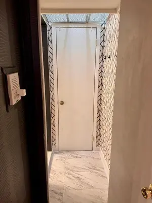 a door leading into a room with a tile floor at Gotham House in New York